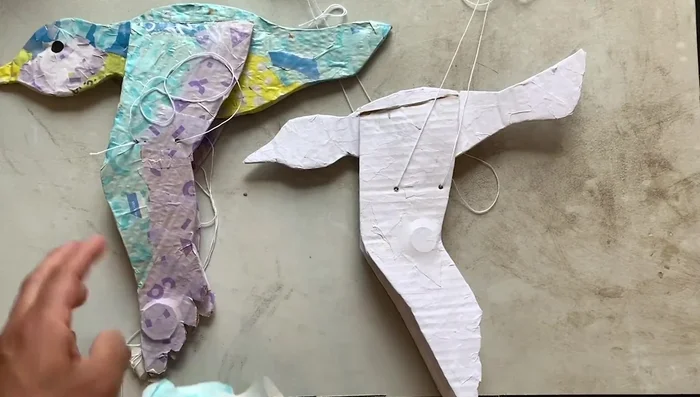 Decorate the bird using paint, colored paper, markers, or colored pencils. (The video shows an example using markers and colored pencils to decorate the bird.)