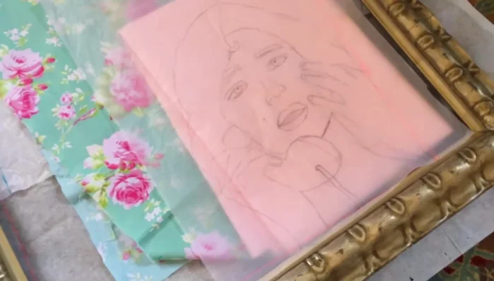 Position your design fabric (right side up) on top of your background fabric. Secure and trace the design.