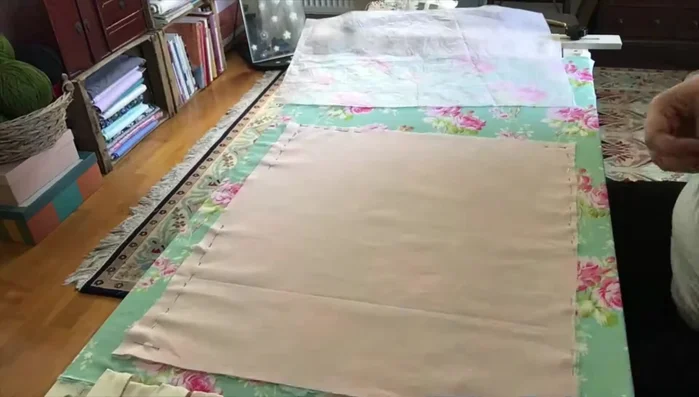 Position your design fabric (right side up) on top of your background fabric. Secure and trace the design.