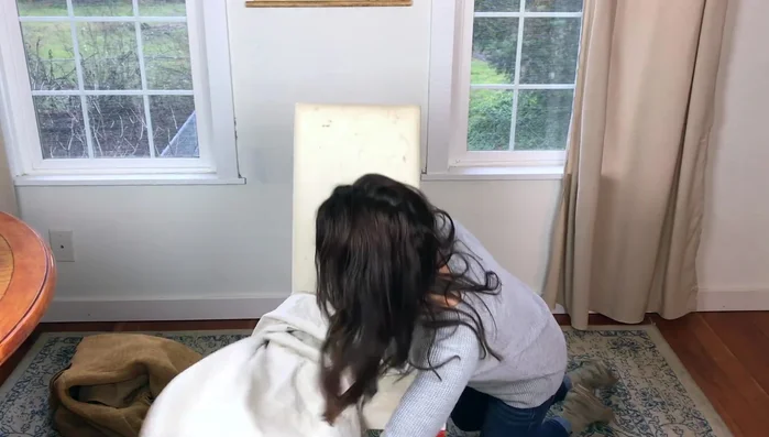 Cut around the pinned fabric, leaving an inch or two of overhang.