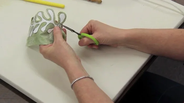 Clip the curves of the fabric, staying about 1/8 inch away from the freezer paper to prevent raw edges.