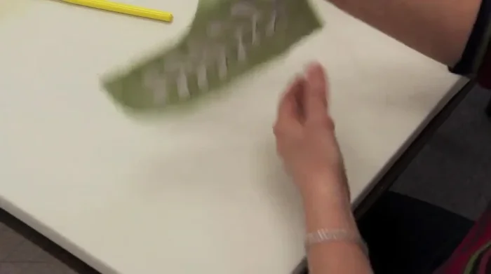 Clip the curves of the fabric, staying about 1/8 inch away from the freezer paper to prevent raw edges.