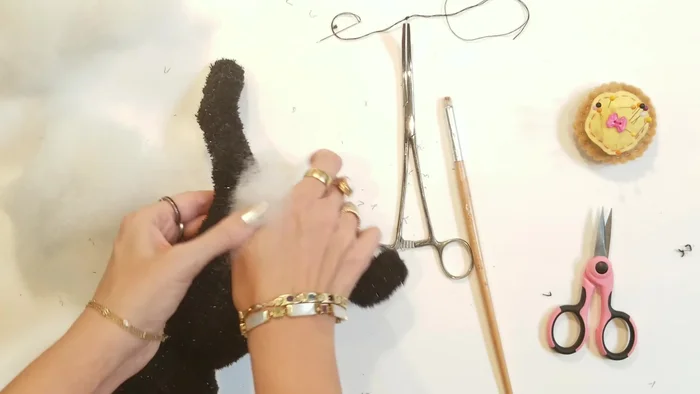 Close the leg openings: Using a ladder stitch, close the leg openings.