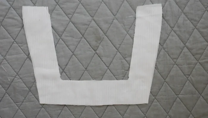 Fuse interfacing onto the wrong side of front and back neckline facings.