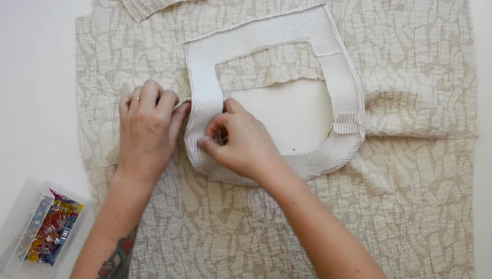 Understitch seam allowance to neckline facing.