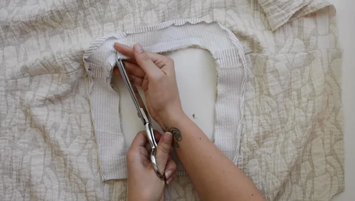 Understitch seam allowance to neckline facing.