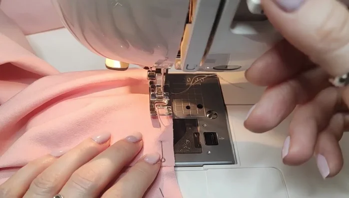 Attach sleeves to armholes. Gather bottom of sleeves and cuffs. Attach cuffs.