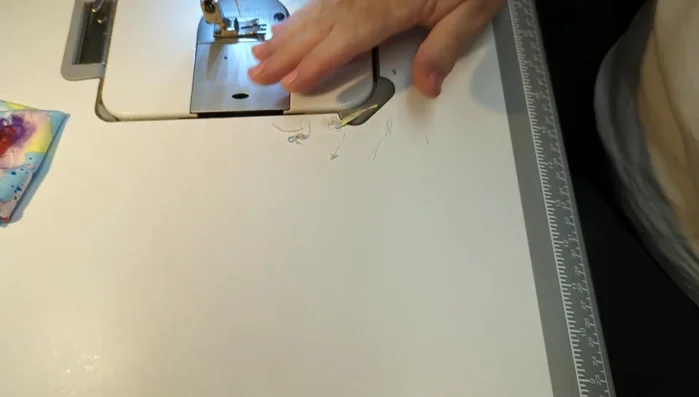 Trim excess threads.