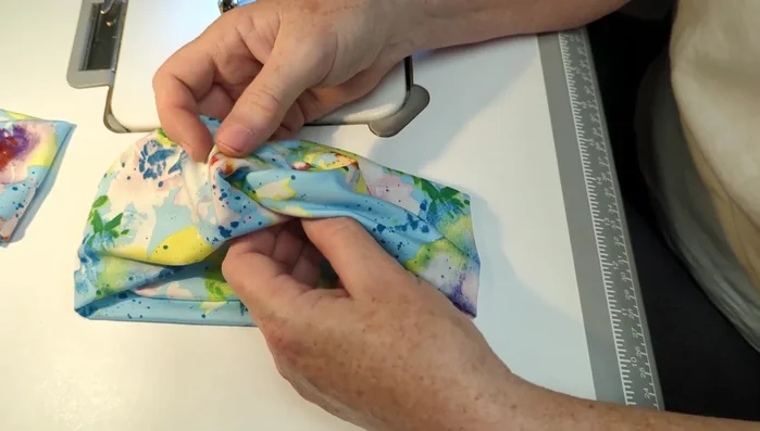 Pull on the ends to make the knot more defined.