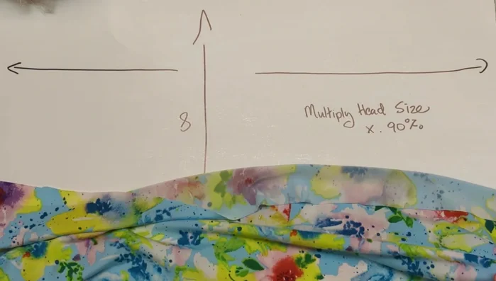 Cut a rectangle of stretchy knit fabric with the stretch from side to side.