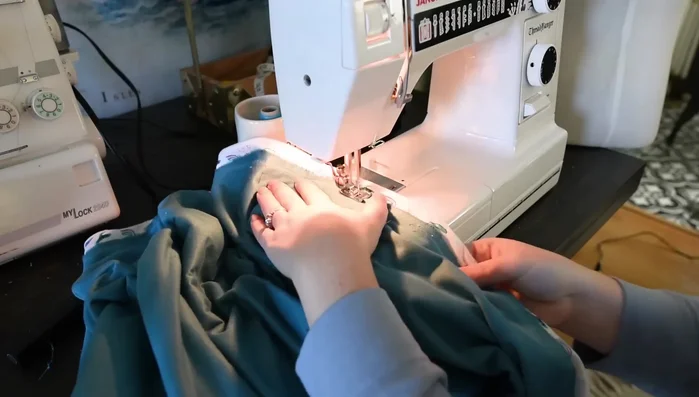 Sew the two large fabric pieces together using a ½ inch seam allowance and a long stitch length. Leave a 5-inch opening on each side for the button placket.