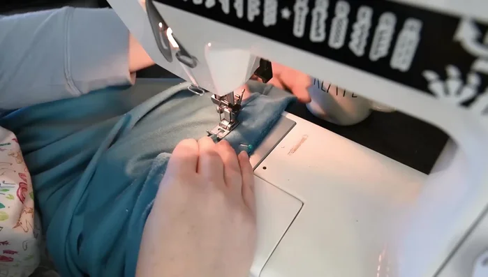 Sew the prepared hems of the button placket strips down, close to the folded edge (about ¼ inch).