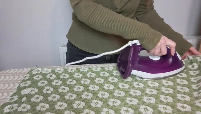 Prepare the fabric: Iron it for a flat surface (optional), place the hat on the fabric, trace around it, cut the fabric, and cut notches around the edges for easier curving.