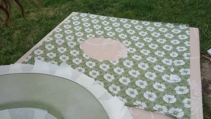 Apply fabric adhesive to the underside of the brim and the back of the fabric. Stick the two together, smoothing out any wrinkles.