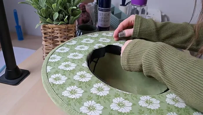 Reattach the hatband using a sewing machine or by hand.