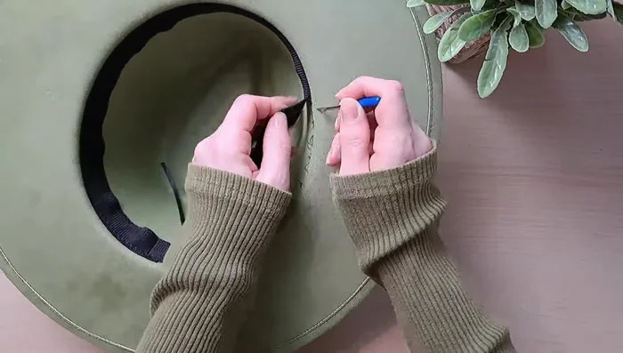 Apply masking tape to the edge of the brim to protect it from glue.