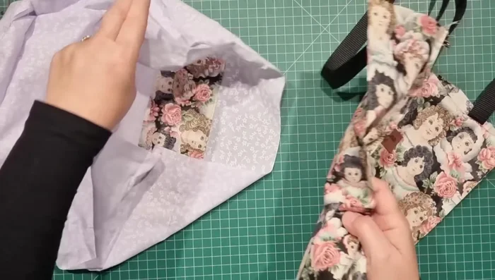 Assemble Bag: Place the lining inside the outer bag, aligning the seams. Topstitch around the top edge, securing the lining and outer fabrics together.