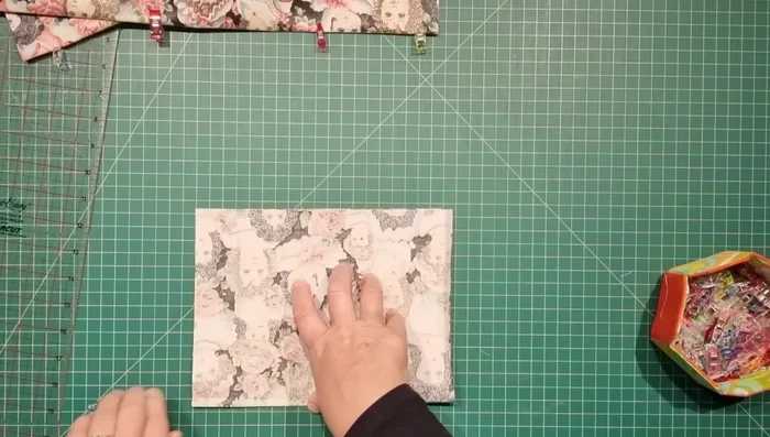 Make the Pocket: Fold the pocket fabric in half, sew the sides, clip corners, turn right side out, and topstitch the folded edge.