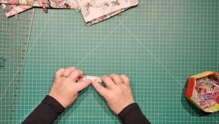 Make the Tabs (optional): Cut fabric strips, fold in half lengthwise, fold raw edges to the center, fold in half again, and stitch along the long edges.
