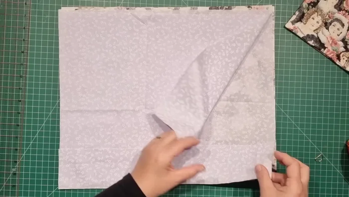 Attach Pocket to Lining: Center the pocket on one lining piece, 4 inches (10 cm) from the top edge, and stitch around, leaving an opening at the bottom for turning.