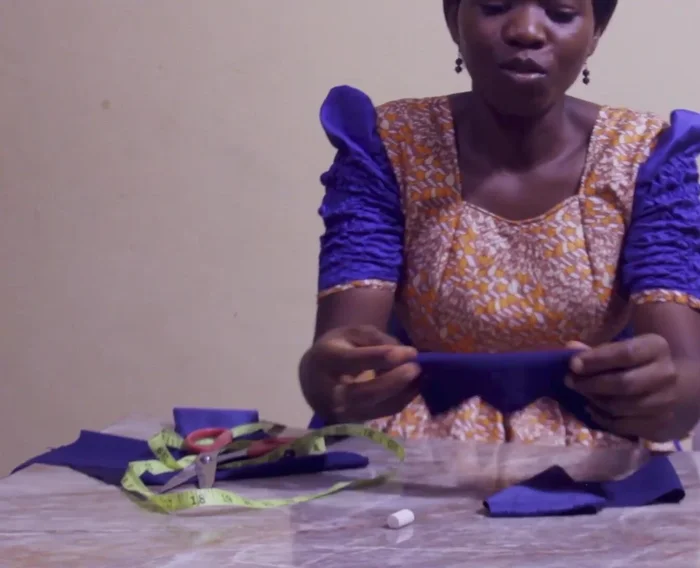 Stitch Fabric Strips: Stitch the long edges of each doubled fabric strip together. You can hand-stitch or use a sewing machine. Make two pairs of the shorter strips and one longer strip.