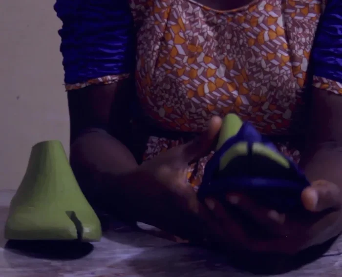 Glue and Secure: Apply transparent glue to the edges where the shorter strips meet the longer strip. Carefully press and hold until the glue sets. Then fold the excess fabric over the edges of the longer strip and secure with glue, creating a neat finish.