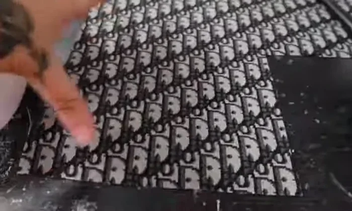 Apply glue to the shoe and carefully place fabric over the taped area. Press firmly to ensure adhesion. For thicker fabrics, remove the Nike check mark before applying fabric.