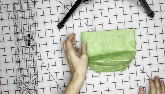 Insert drawstrings (shoelaces, ribbon, etc.) through the casings using a threading tool. Tie off the ends of the drawstrings.