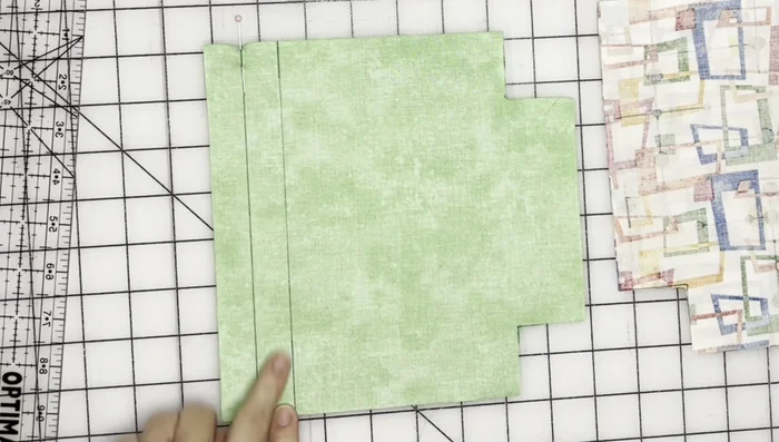 Sew the main fabric pieces together, using a 0.25-inch seam allowance. Remember to leave the openings for the drawstring gaps unsewn.