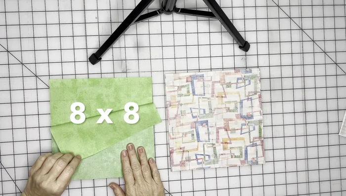 Cut out 1.5x1.5 inch squares from each corner of both main fabric and lining pieces to create the box bottom.