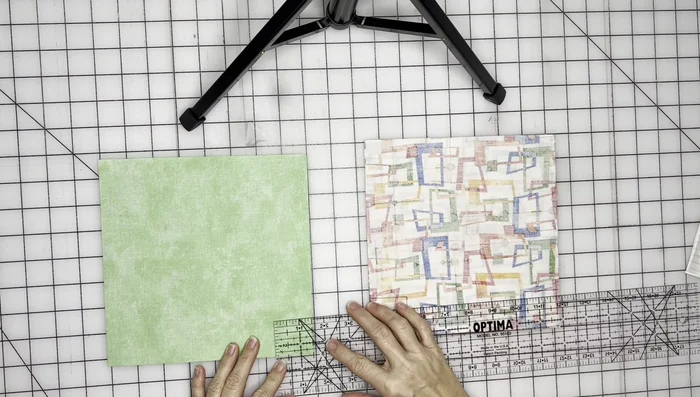 Cut out 1.5x1.5 inch squares from each corner of both main fabric and lining pieces to create the box bottom.