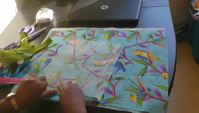 Create and attach side pocket (optional). Cut out your desired pocket shape, iron edges, and pin it to the bag’s front panel at the appropriate location. Sew down before attaching to the main bag.