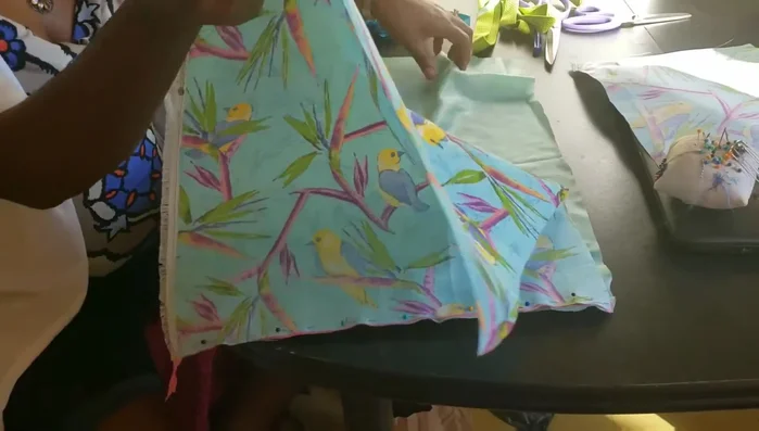 Sew the main bag panels. Sew the two sides of the zipper (with fabric and lining attached) together. Leave a gap to turn the bag right side out.