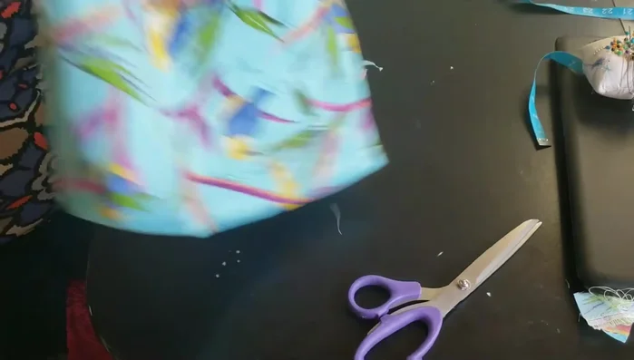 Attach handles/straps. Measure and cut the straps, making sure that the straps are properly measured to your liking. Place straps on the top edge of the bag, pin and stitch.