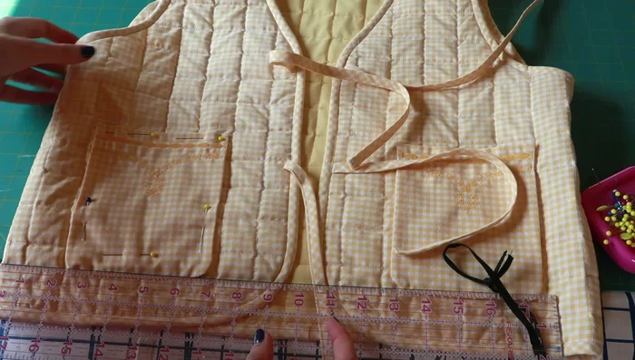 Hand stitch pockets onto the vests.