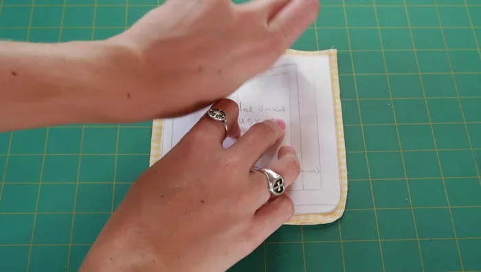 Cut out pocket pieces for the yellow gingham vest.