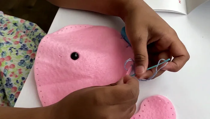 Sew the whale body: Use a whip stitch to sew the edges of the whale's body together, leaving a gap for stuffing.