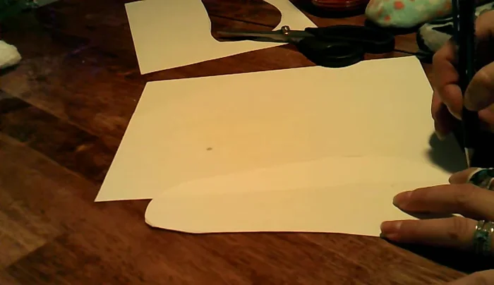 Design the boot shape by extending the traced foot shape upwards, considering the desired height and stretch.