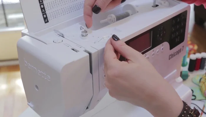 Load the wound bobbin into the machine.