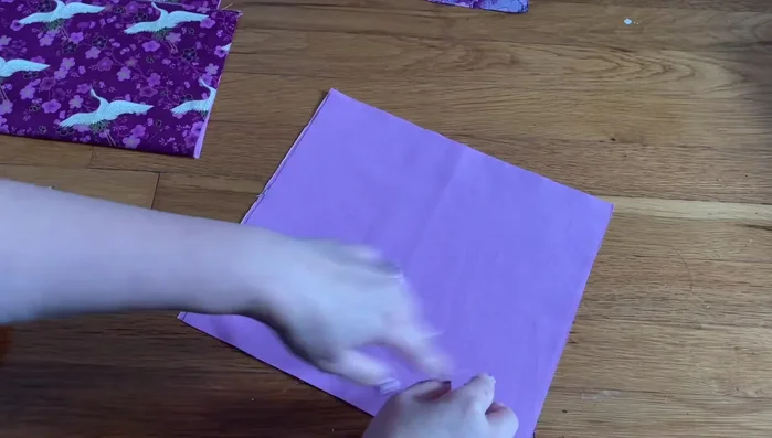 Attach the pocket to the main body. 