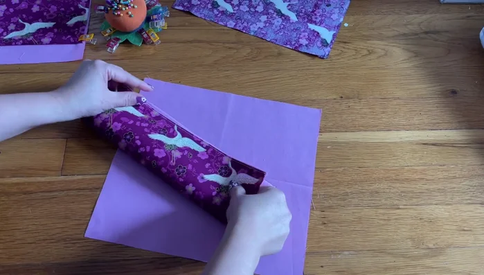 Attach the pocket to the main body. 