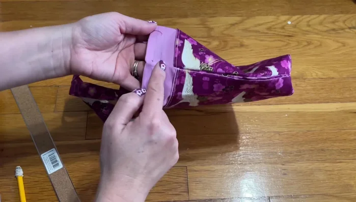 Add drawstrings and buttons.