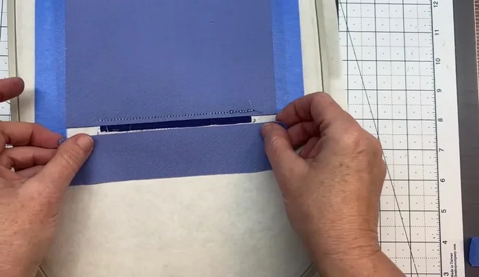 Attach the top lining piece and tape. Run color stop 15.