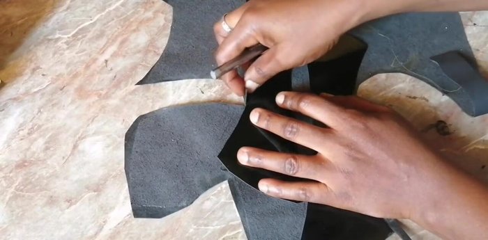 Line the front pattern with the lining leather. Apply contact adhesive to both the upper and lining leathers.