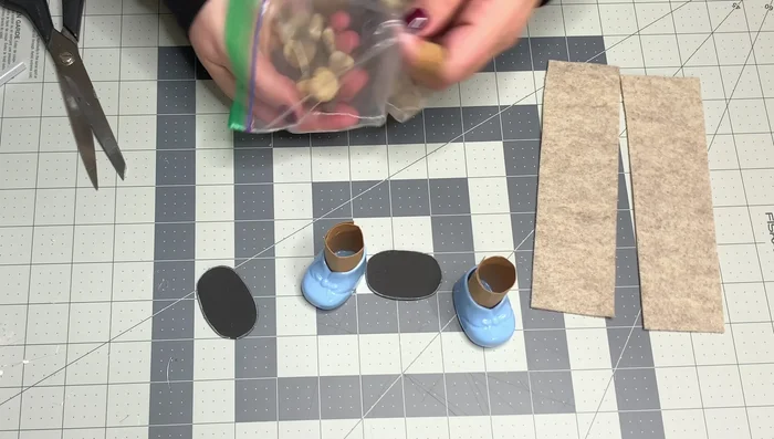 Fill the inside of the boot with Dollar Tree vase filler (rocks) to add weight and stability. Avoid using food products like beans or rice.