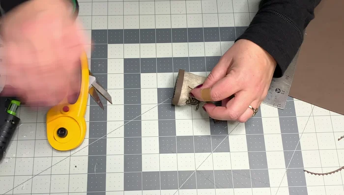 Glue the embroidery threads to the bottom to prevent fraying. Glue them to the boot.