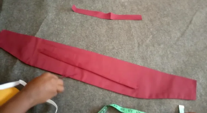 Insert the elastic band through the elastic casing using a safety pin. Secure the ends.