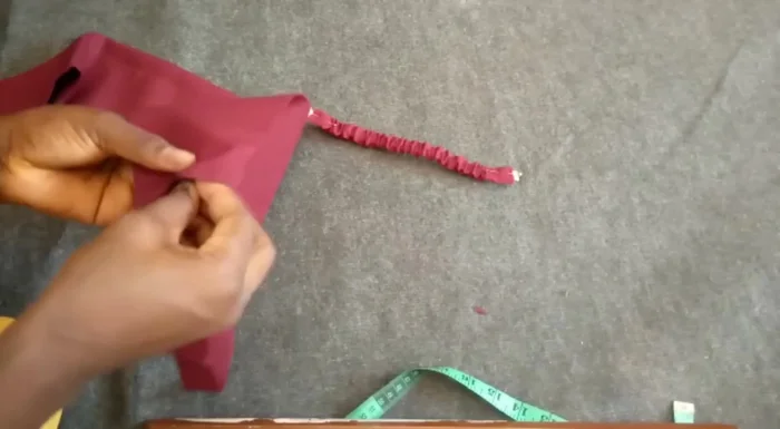 Stitch the smaller fabric piece to the main headband (0.5 inch seam allowance).