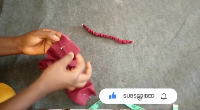 Stitch the smaller fabric piece to the main headband (0.5 inch seam allowance).