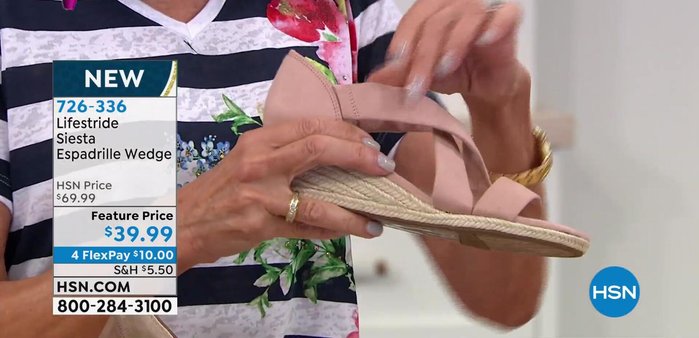 Further demonstration of the shoe's elastic straps for a comfortable fit.